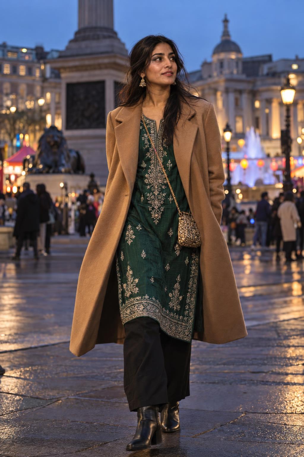 Woman in an emerald kurta and camel coat near Trafalgar Square for Diwali on the Square